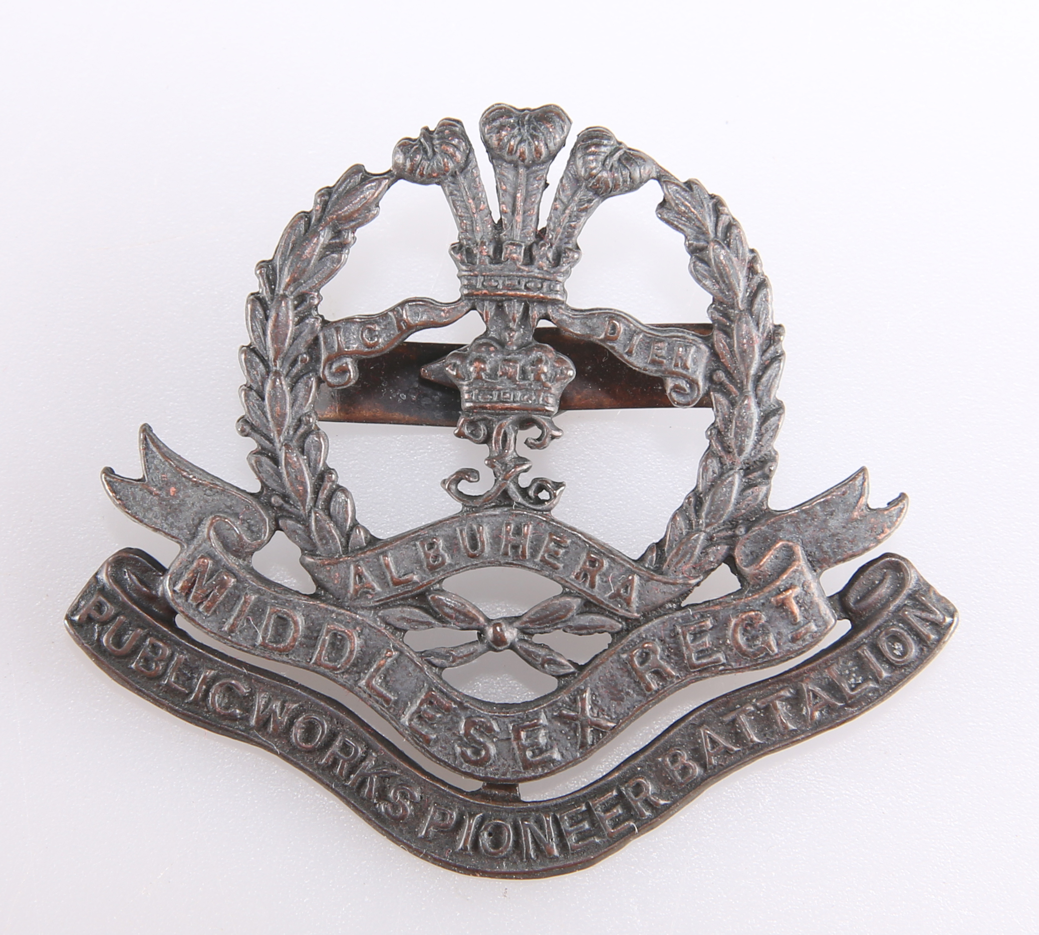 A WWI BRONZE OFFICERS' PATTERN SERVICE DRESS CAP BADGE