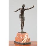 AN ART DECO STYLE BRONZE FIGURE OF A DANCER