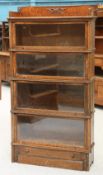 AN EARLY 20TH CENTURY OAK STACKING BOOKCASE