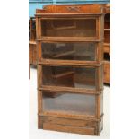 AN EARLY 20TH CENTURY OAK STACKING BOOKCASE