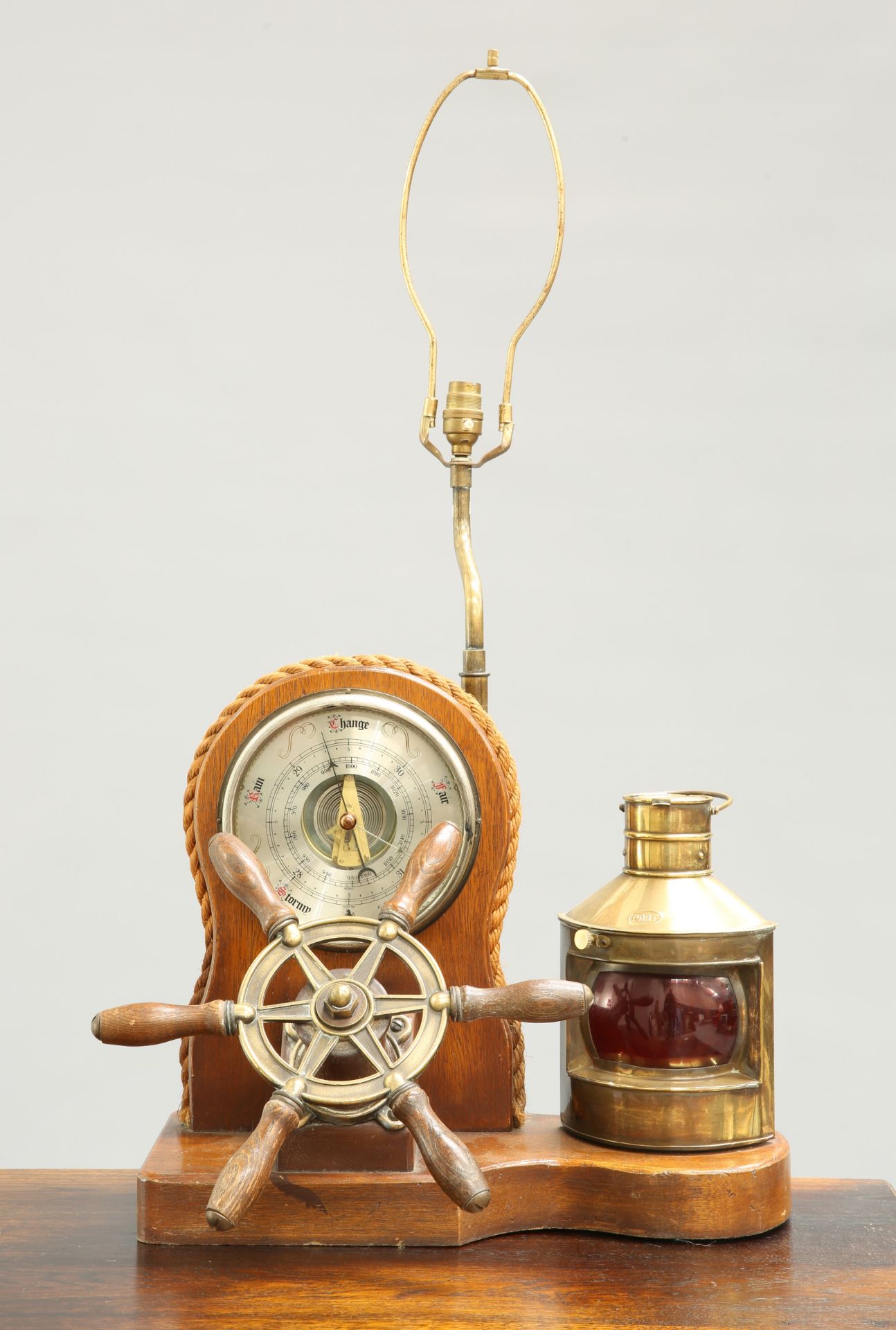 A BRASS-MOUNTED LAMP AND BAROMETER SET OF NAUTICAL INTEREST