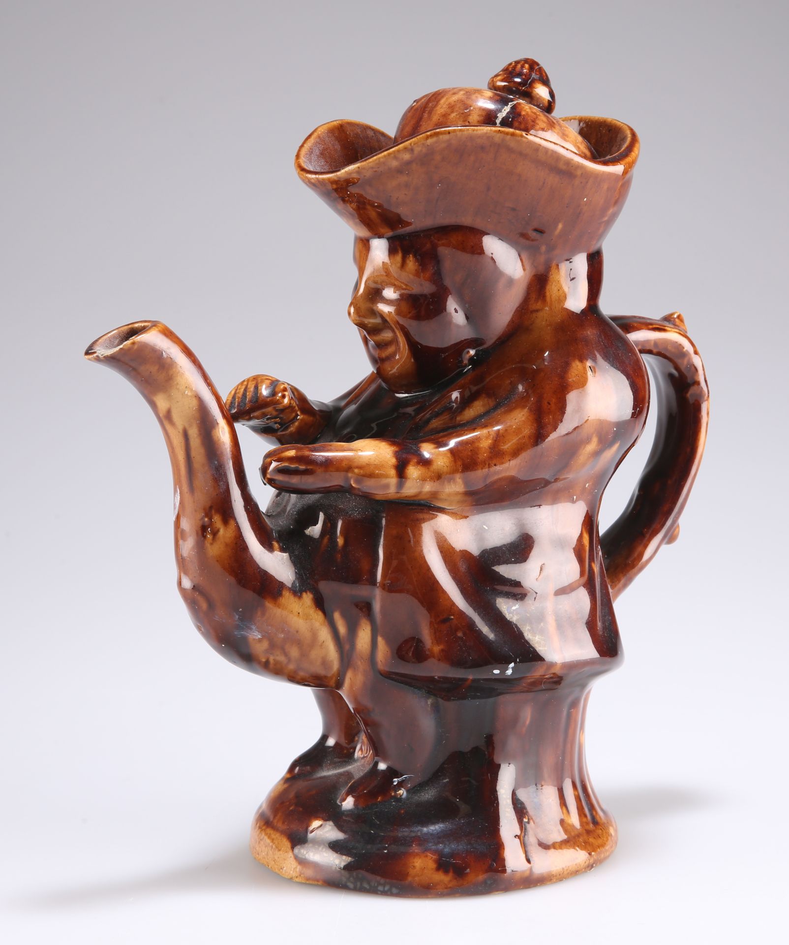 A 19TH CENTURY TREACLE-GLAZED TOBY TEAPOT - Image 2 of 3