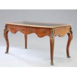 A FRENCH ORMOLU MOUNTED AND LEATHER-INSET BUREAU PLAT