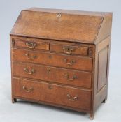 AN 18TH CENTURY OAK SLANT-FRONT BUREAU