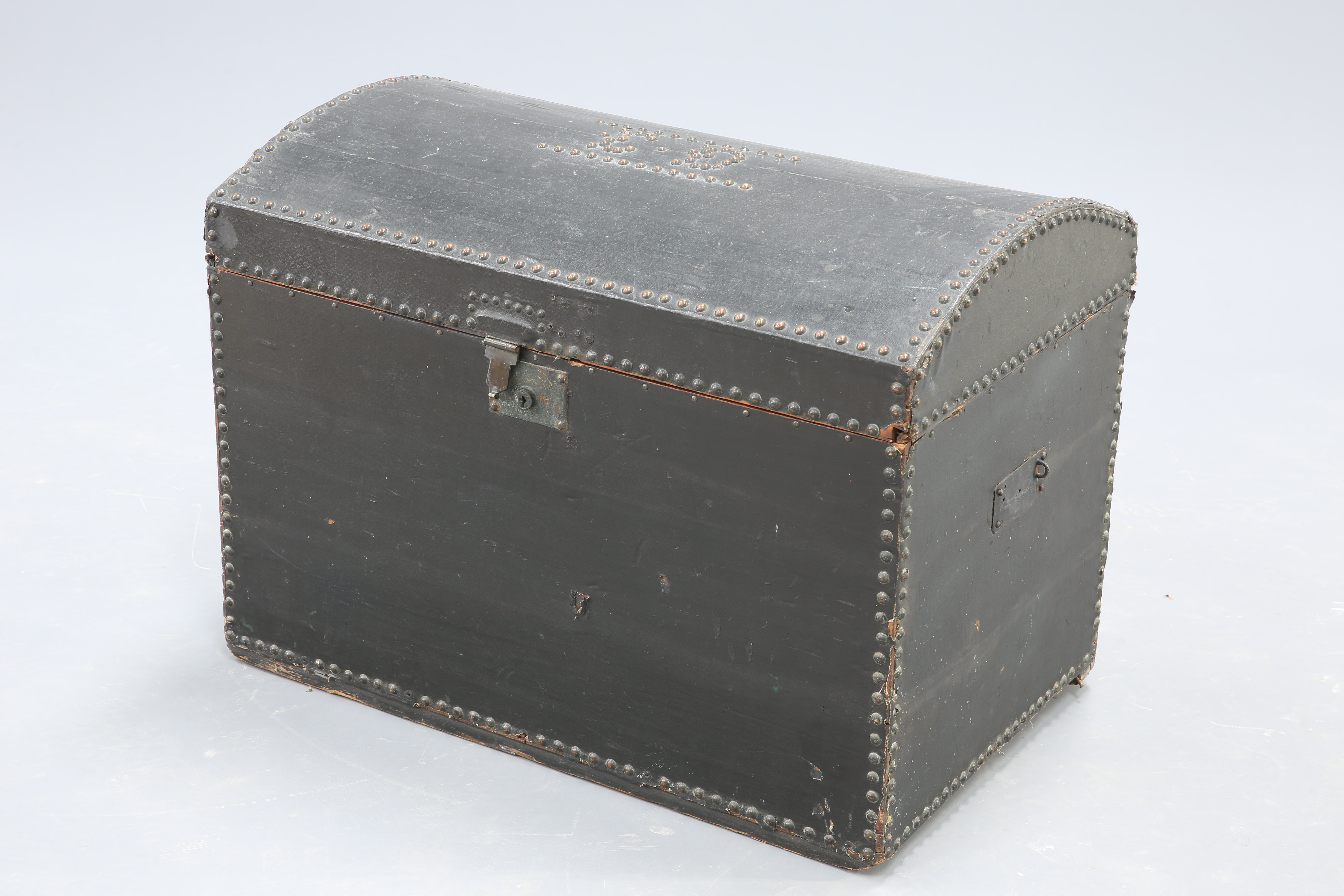 A 19TH CENTURY BRASS-STUDDED LEATHER DOME-TOP TRUNK