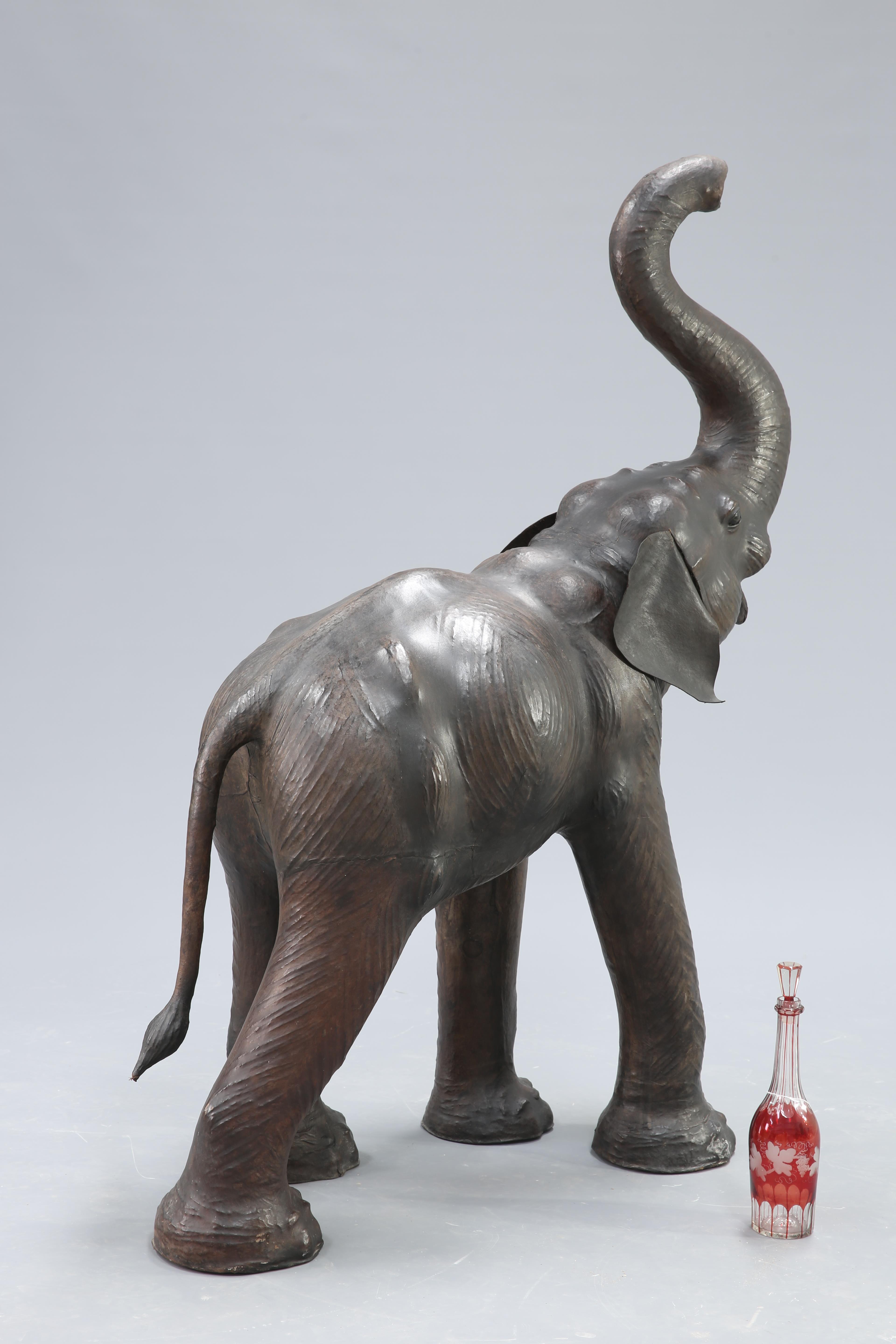 AN UNUSUALLY LARGE LEATHER MODEL OF AN ELEPHANT - Image 4 of 4