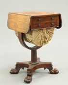 A REGENCY ROSEWOOD DROPLEAF WORK TABLE