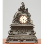 A FRENCH 19TH CENTURY PATINATED BRONZE MANTEL CLOCK
