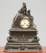 A FRENCH 19TH CENTURY PATINATED BRONZE MANTEL CLOCK