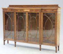 AN EDWARDIAN INLAID MAHOGANY BREAKFRONT BOOKCASE