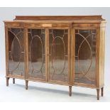 AN EDWARDIAN INLAID MAHOGANY BREAKFRONT BOOKCASE