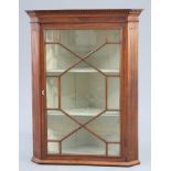 A GEORGE III MAHOGANY HANGING CORNER CABINET