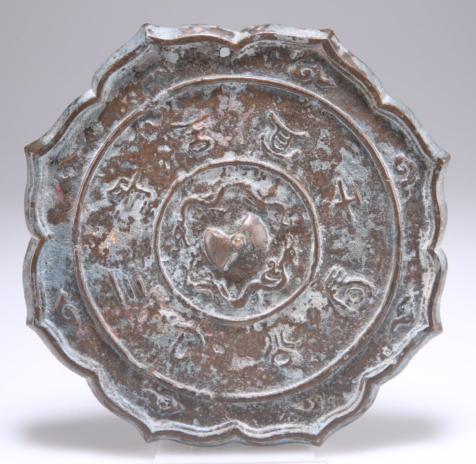 A 19TH CENTURY CHINESE BRONZE MIRROR