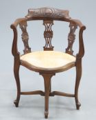 A LATE VICTORIAN CARVED WALNUT CORNER CHAIR