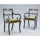 A PAIR OF REGENCY STYLE PAINTED AND GILDED OPEN ARMCHAIRS