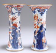 A NEAR PAIR OF 18TH CENTURY CHINESE IMARI GU VASES