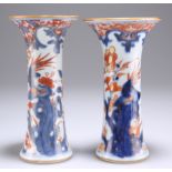 A NEAR PAIR OF 18TH CENTURY CHINESE IMARI GU VASES