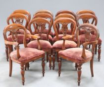 A MAHOGANY WIND OUT DINING TABLE AND TWELVE CHAIRS