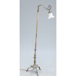 AN EDWARDIAN BRASS STANDARD LAMP