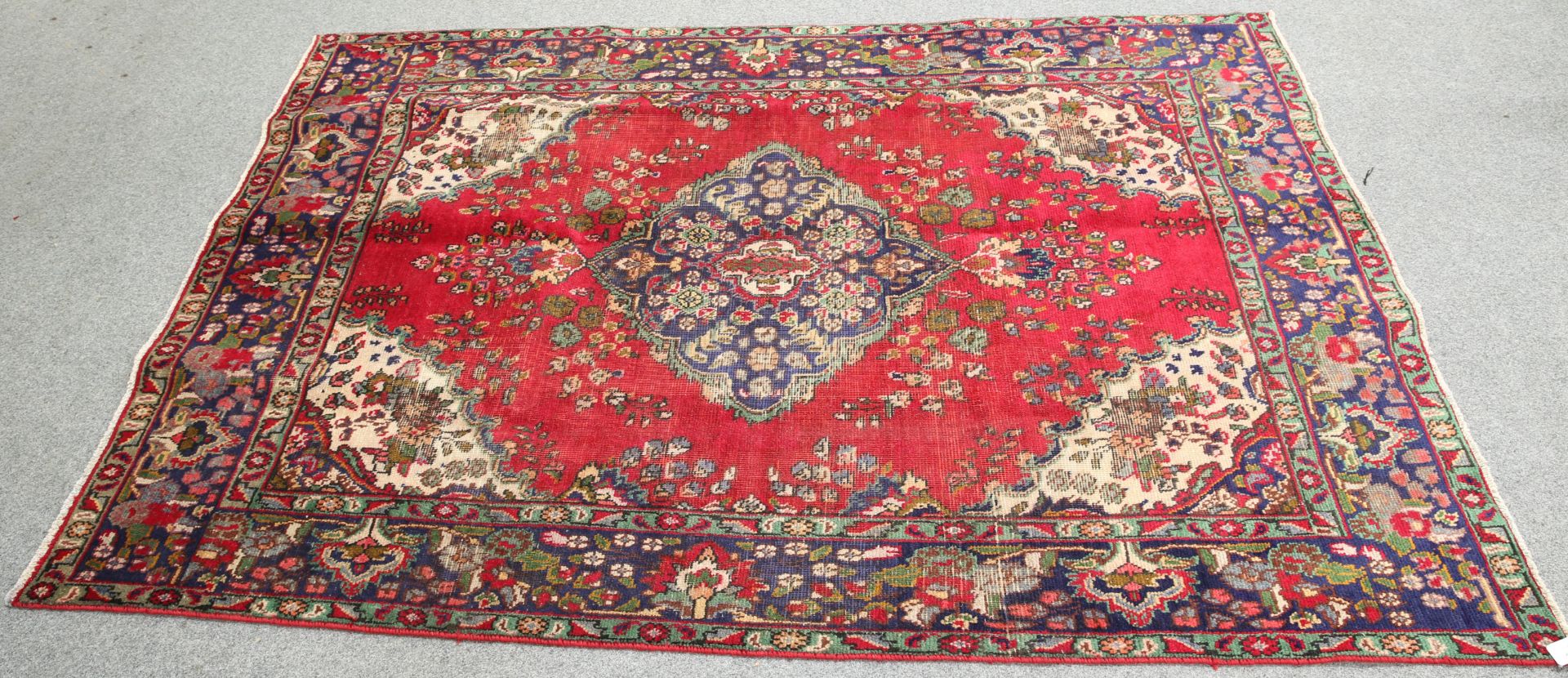 A VINTAGE PERSIAN TABRIZ CARPET