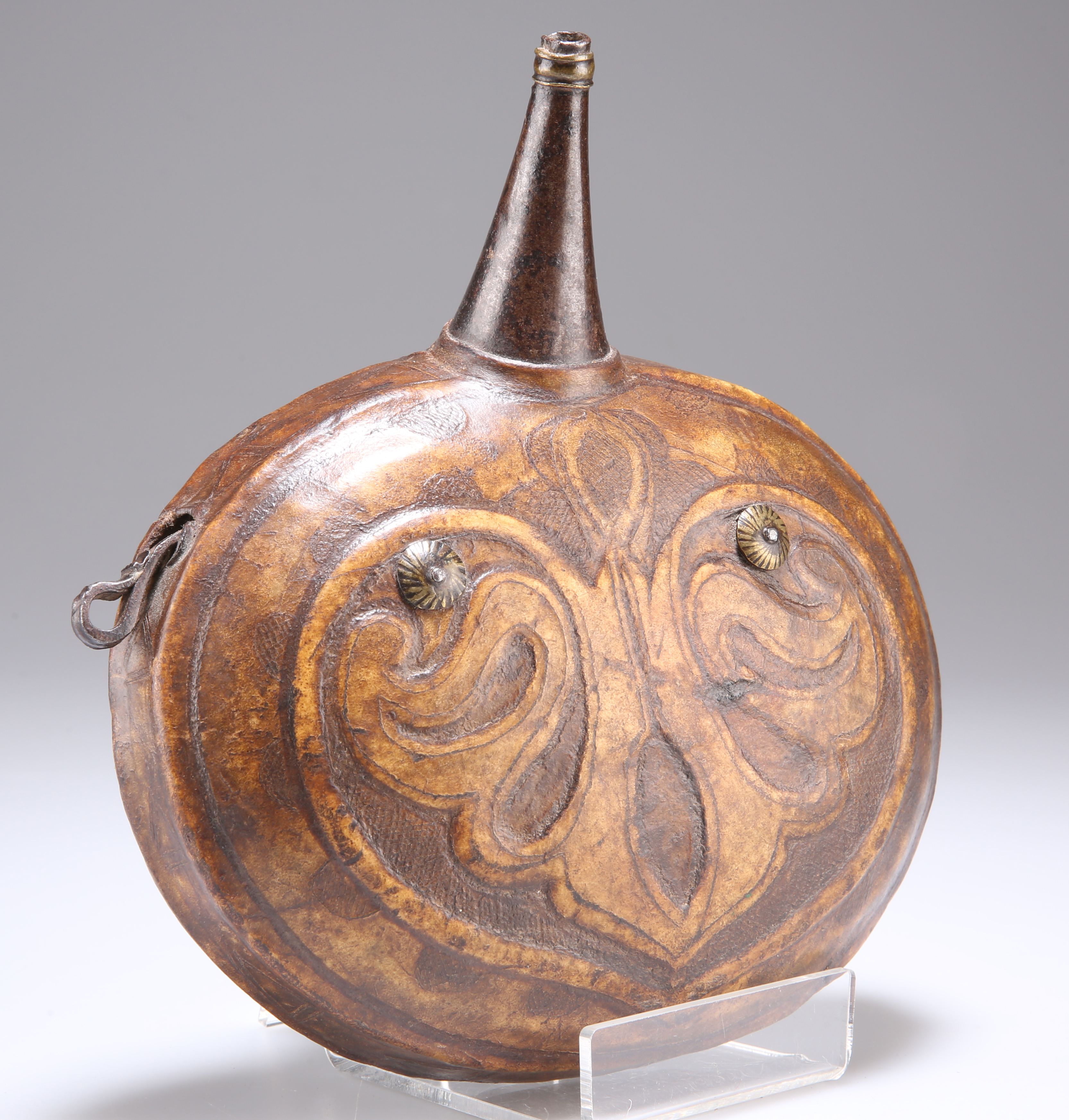 A LEATHER POWDER FLASK, MIDDLE EASTERN OR NORTH AFRICAN