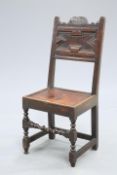 A 17TH CENTURY OAK PANEL-BACK CHAIR