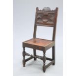 A 17TH CENTURY OAK PANEL-BACK CHAIR