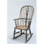 AN ELM AND OAK WINDSOR ROCKING CHAIR