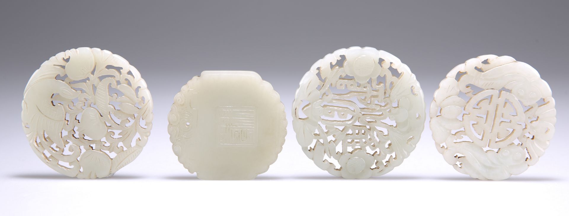 A GROUP OF FOUR CHINESE JADE DISCS - Bild 2 aus 2