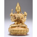 A TIBETAN GILT BRONZE GELPUGA LAMA