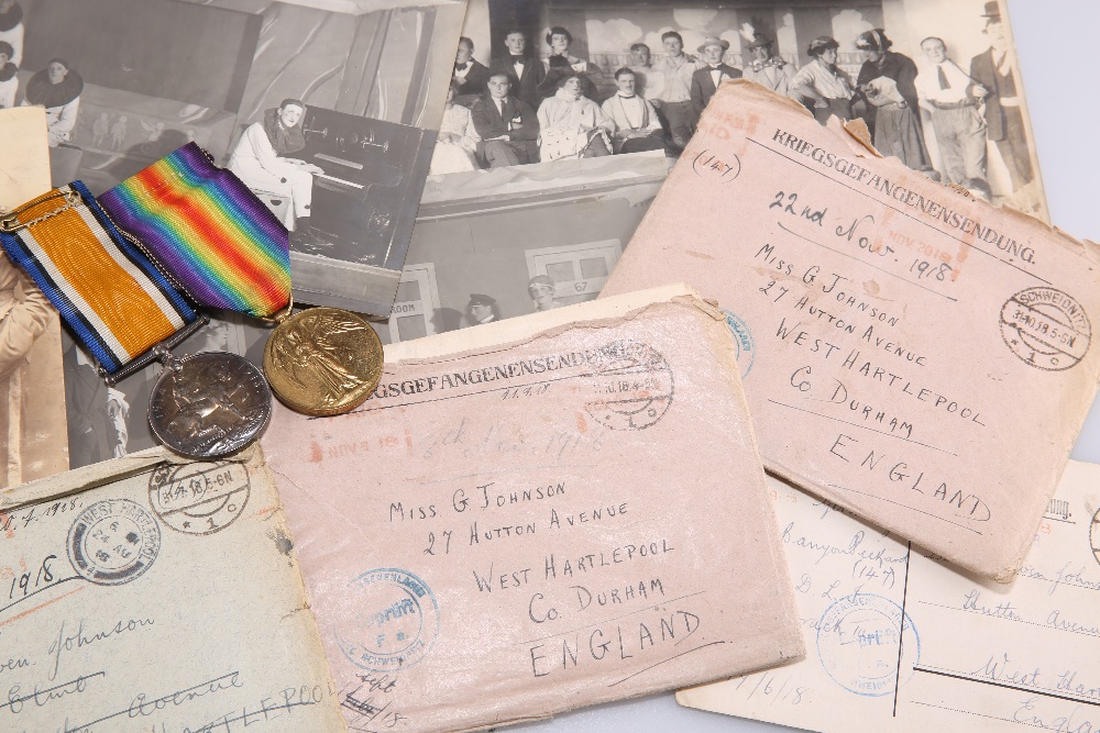 A COLLECTION OF WWI PRISONER OF WAR (POW) LETTERS, A PHOTOGRAPH ALBUM AND TWO WWI MEDALS