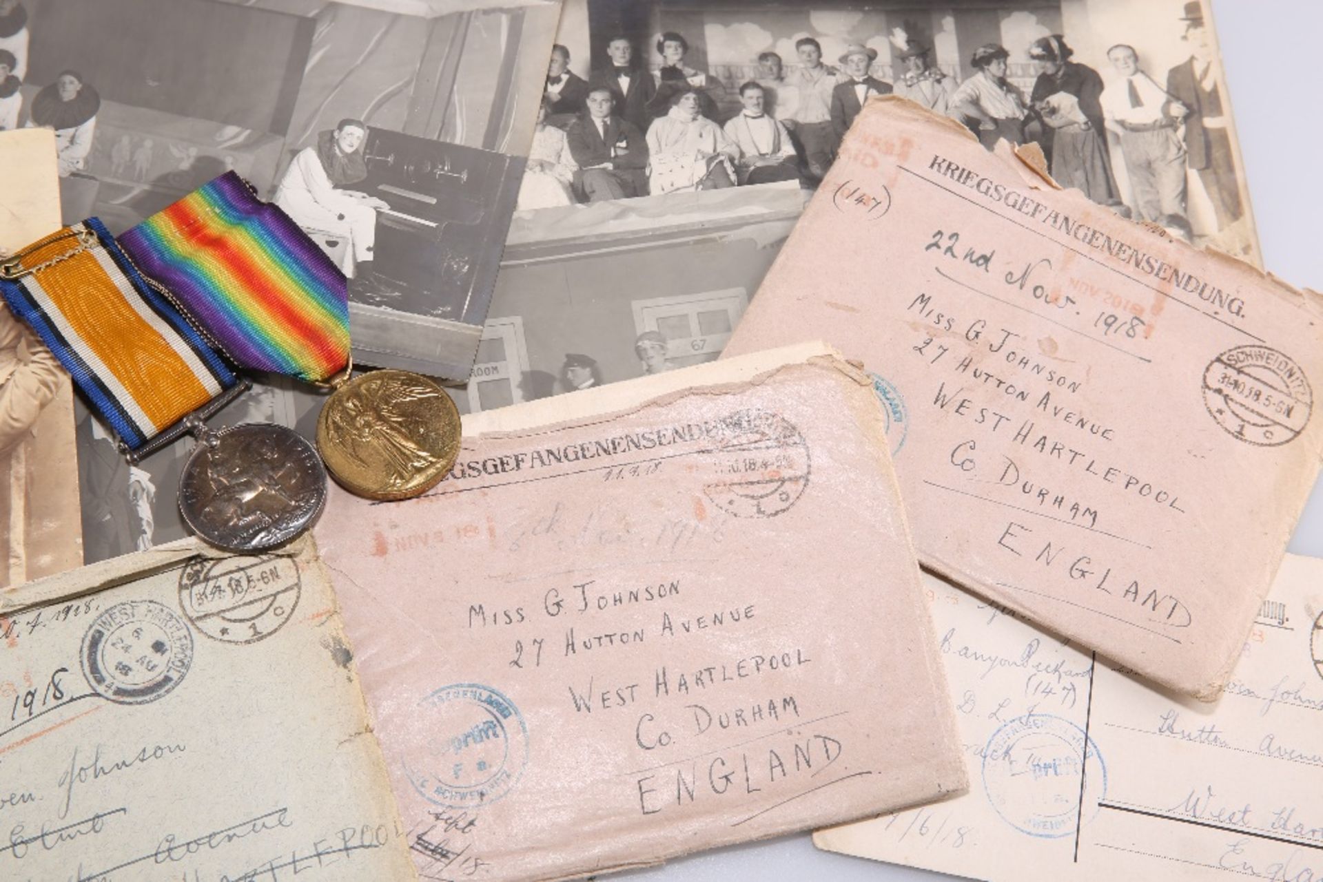 A COLLECTION OF WWI PRISONER OF WAR (POW) LETTERS, A PHOTOGRAPH ALBUM AND TWO WWI MEDALS