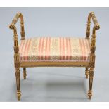 AN ADAM STYLE GILTWOOD AND UPHOLSTERED STOOL