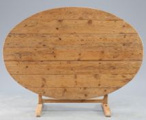 A 19TH CENTURY FRENCH PINE WINE TASTING TABLE