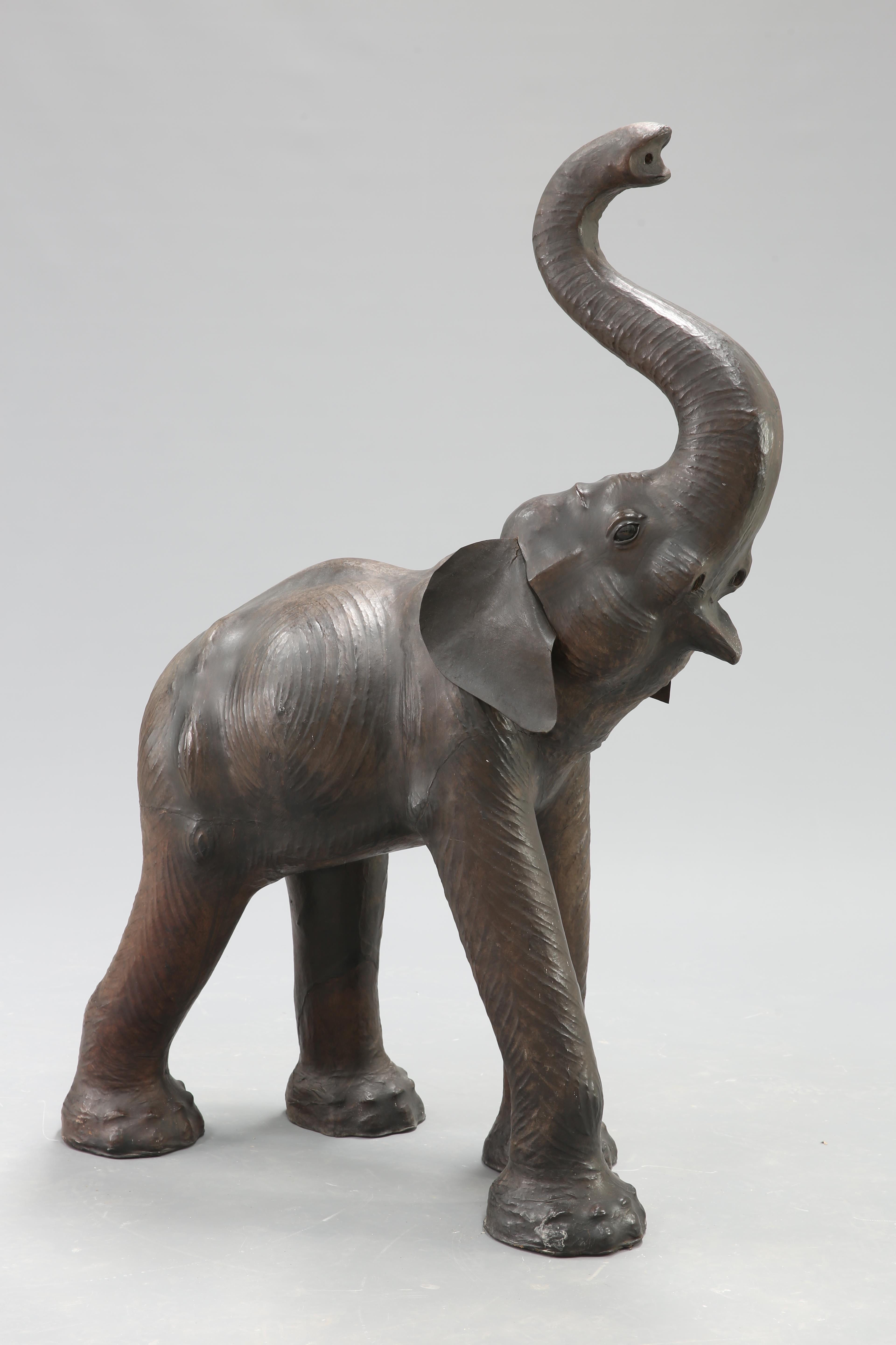 AN UNUSUALLY LARGE LEATHER MODEL OF AN ELEPHANT