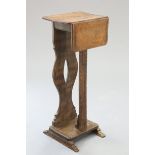 AN UNUSUAL CARVED OAK STAND