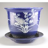 A CHINESE BLUE-GLAZED PORCELAIN JARDINIERE ON STAND