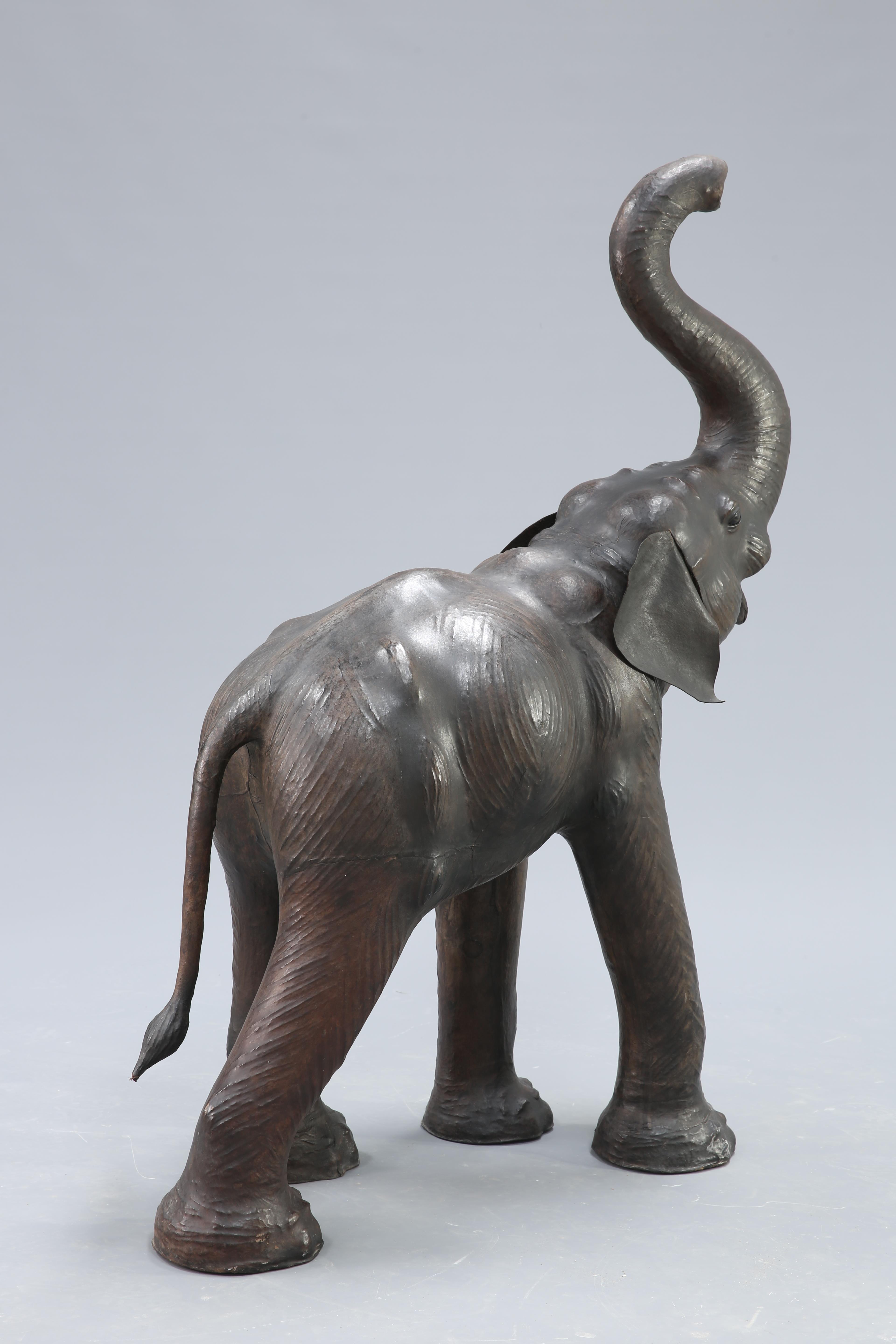 AN UNUSUALLY LARGE LEATHER MODEL OF AN ELEPHANT - Image 2 of 4