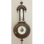 A LATE VICTORIAN WALNUT WHEEL BAROMETER