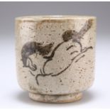 A CHINESE CELADON GLAZED STONEWARE CUP