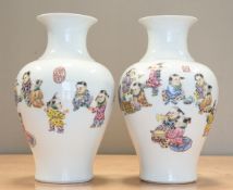 A PAIR OF CHINESE FAMILLE ROSE PORCELAIN 'BOYS' VASES