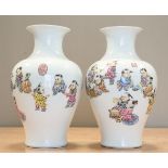 A PAIR OF CHINESE FAMILLE ROSE PORCELAIN 'BOYS' VASES