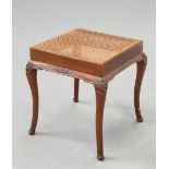 AN EARLY 20TH CENTURY WALNUT AND CANEWORK STOOL