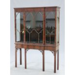 A CHIPPENDALE STYLE MAHOGANY BREAKFRONT VITRINE