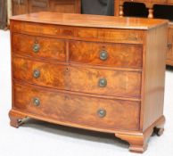 A 19TH CENTURY MAHOGANY BOW-FRONT CHEST OF DRAWERS