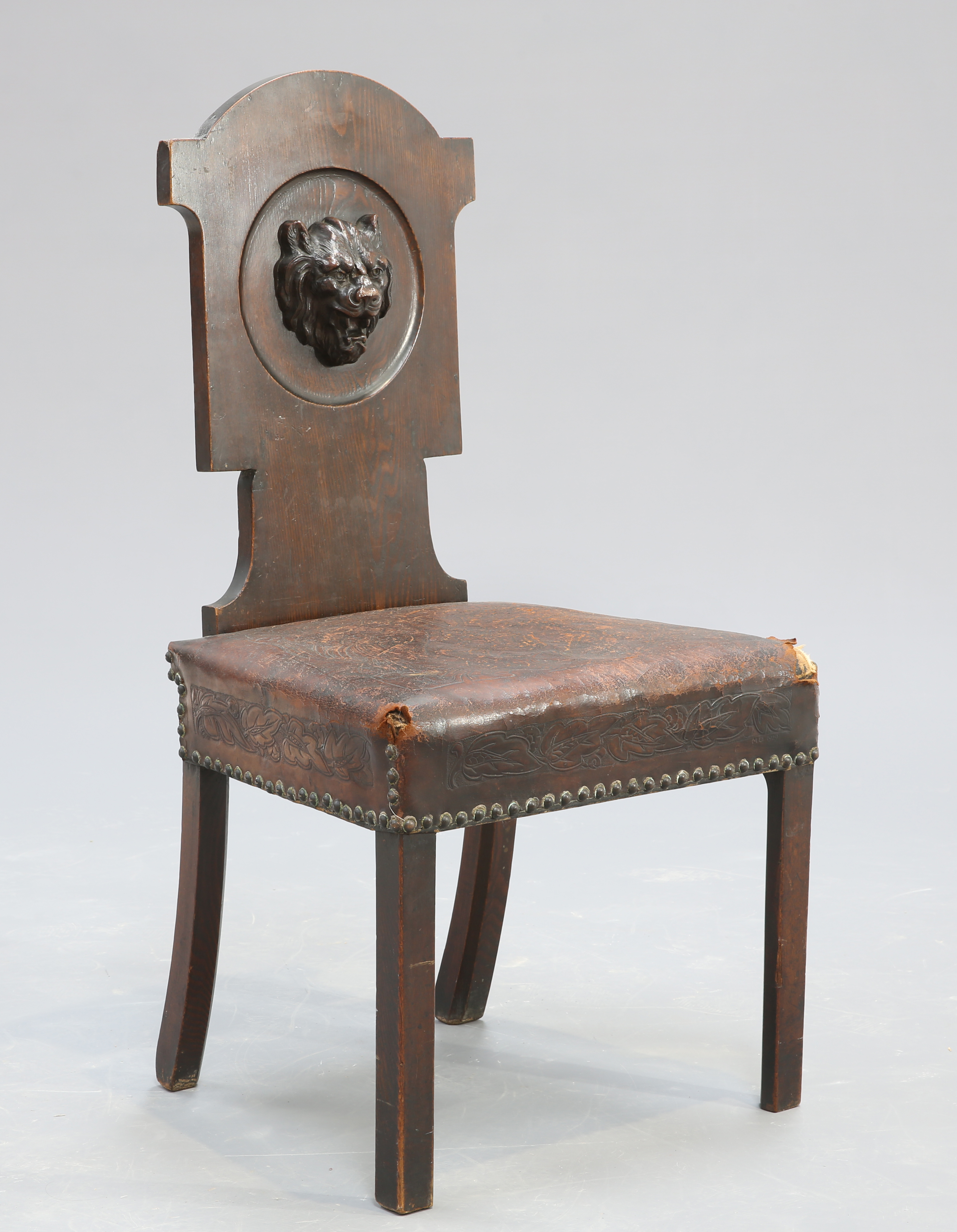 A VICTORIAN OAK AND STAMPED LEATHER HALL CHAIR