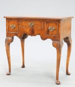 A QUEEN ANNE STYLE BURR WALNUT LOWBOY