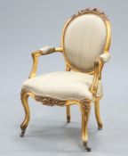 A LOUIS XV STYLE GILTWOOD AND UPHOLSTERED FAUTEUIL