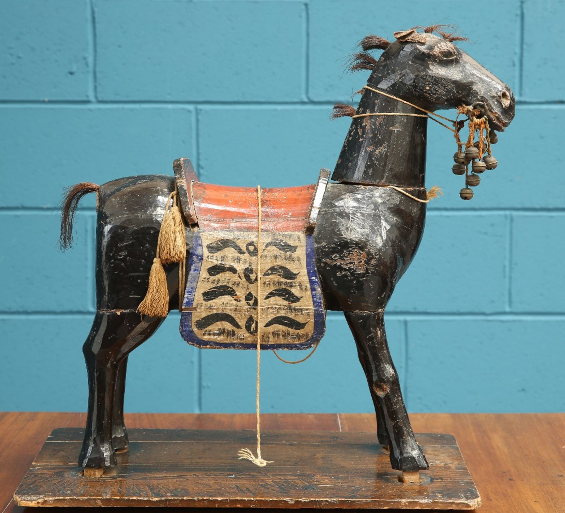 A 19TH CENTURY MIDDLE EASTEN CARVED AND PAINTED MODEL OF A HORSE - Image 2 of 3
