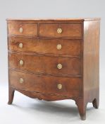 AN EARLY 19TH CENTURY MAHOGANY BOW-FRONT CHEST OF DRAWERS